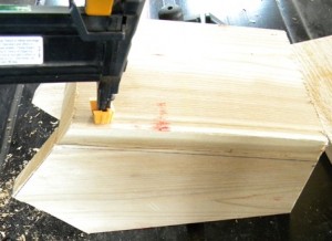 Nailing side of wooden birdhouse